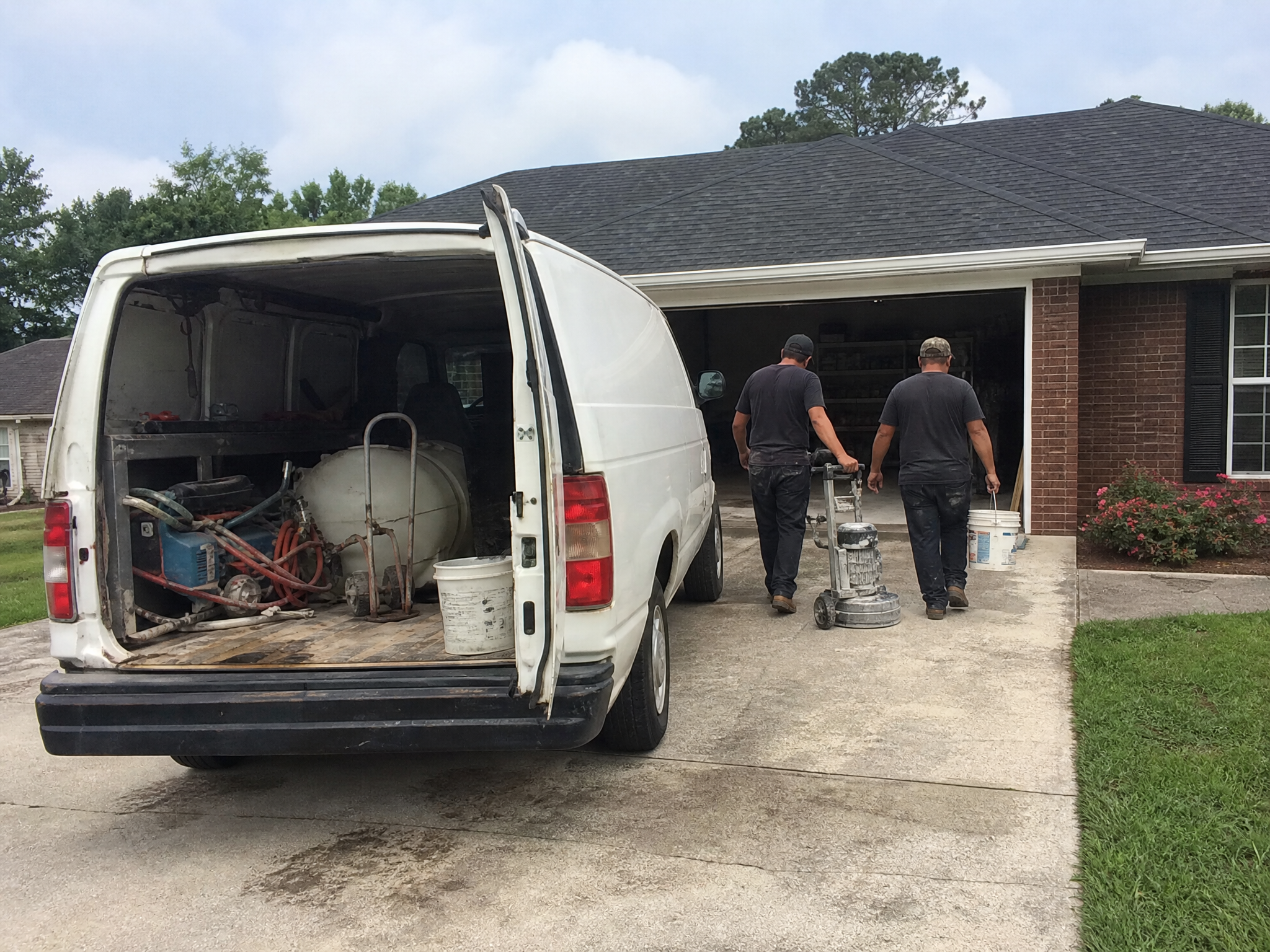 Floor coating work van outside a home in Sumter County, SC