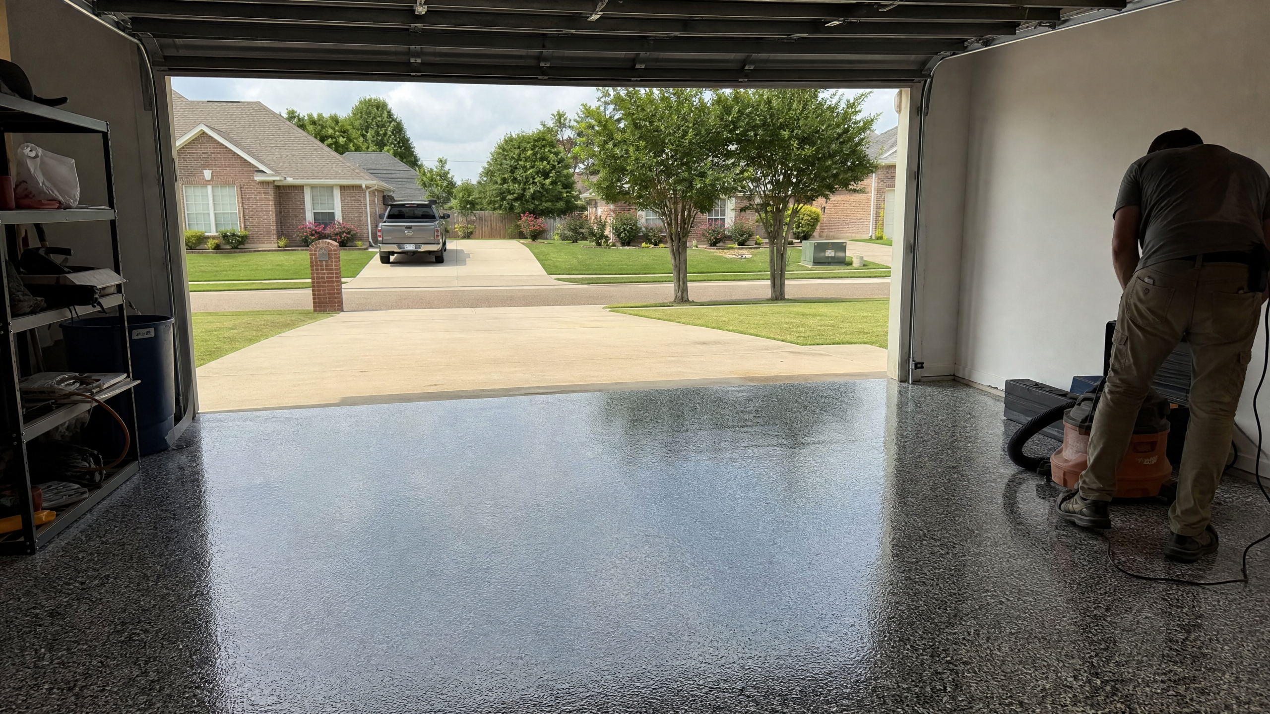 Glossy flake epoxy garage floor in a American home in Sumter County, SC, garage door open to daylight
